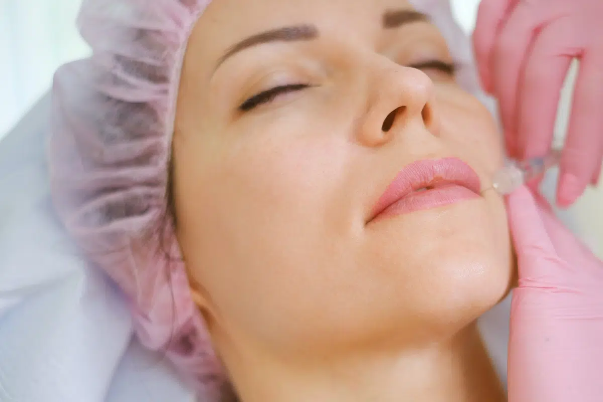 woman getting treatment with injectable hyaluronic acid dermal filler woman getting treatment with injectable hyaluronic acid dermal filler