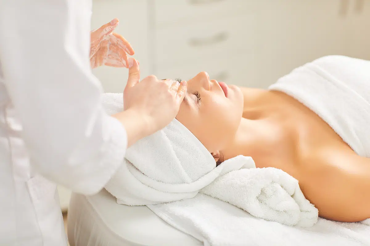 woman patient receiving facial treatment